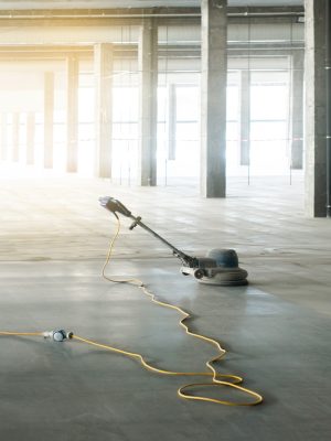 floor polishing machine inside a large industrial building, not people floor polishing machine inside a large industrial building, not people